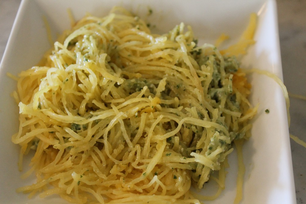 Spaghetti squash with pesto I made yesterday (with one hand! Mary, I think I mentioned, is going through a don't-put-me-down stage. I felt very self-satisfied after managing to wrangle the skins off the garlic cloves--single handed, without a knife.)
