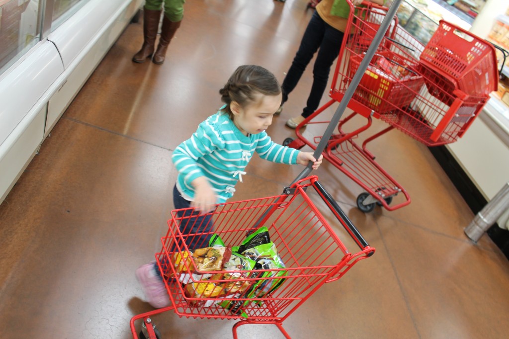At Trader Joe's. She loved putting stuff in the little person shopping cart. 