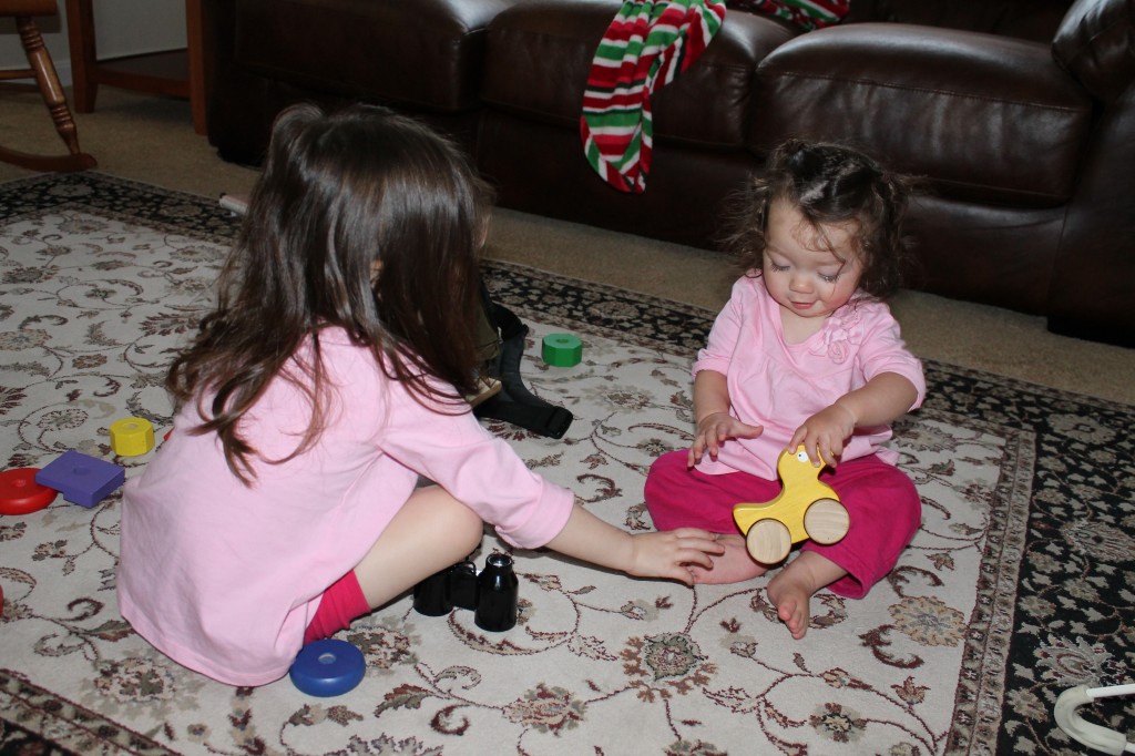 I accidentally put Mary's pants on backwards after her nap. Lydia had put Mary's shorts on backwards, and so they were truly twinning: They're both wearing Mary's pink pants backwards!