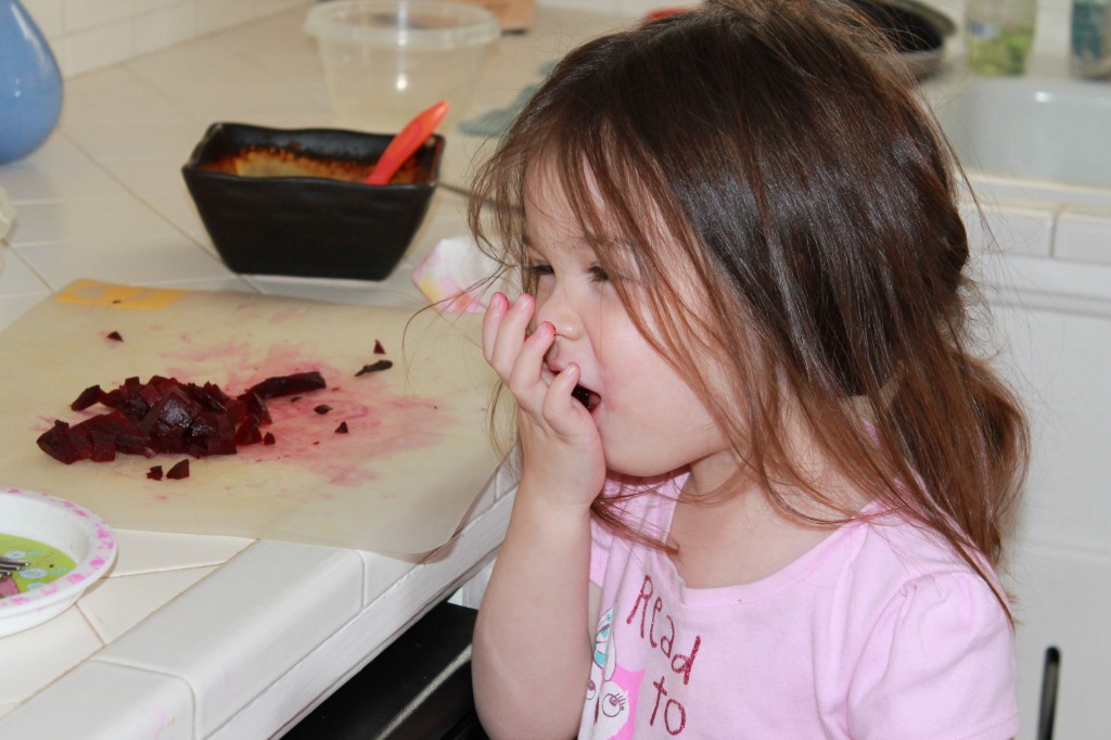 I roasted beets last night while I was cleaning. Beets are our family's favorite food. Lydia found the beets and ate them like this a