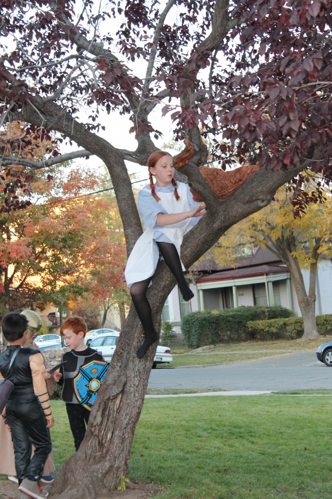 Finally, I was talking to one of my ward friends in the parking lot when we noticed her granddaughter, dressed as Anne Shirley, scramble up a tree. Her grandmother tells me she does that all the time and had nothing to do with her costume, but still, I could NOT resist. Look, everyone! It's Anne Shirley climbing a tree!!