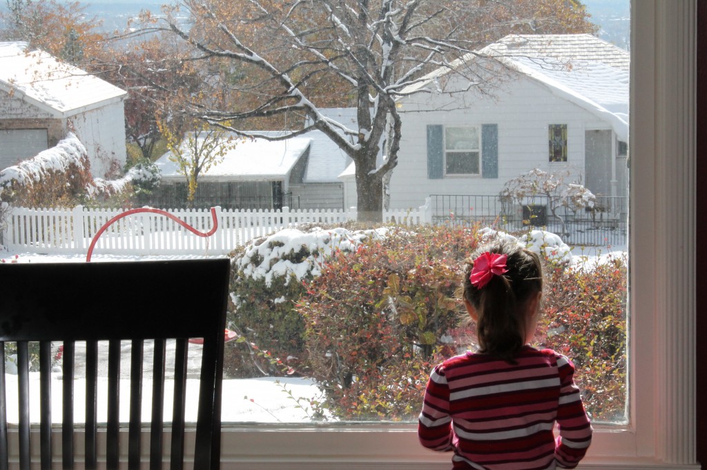 Wistful. A beautiful, white world, and Mommy won't let her leave the house.