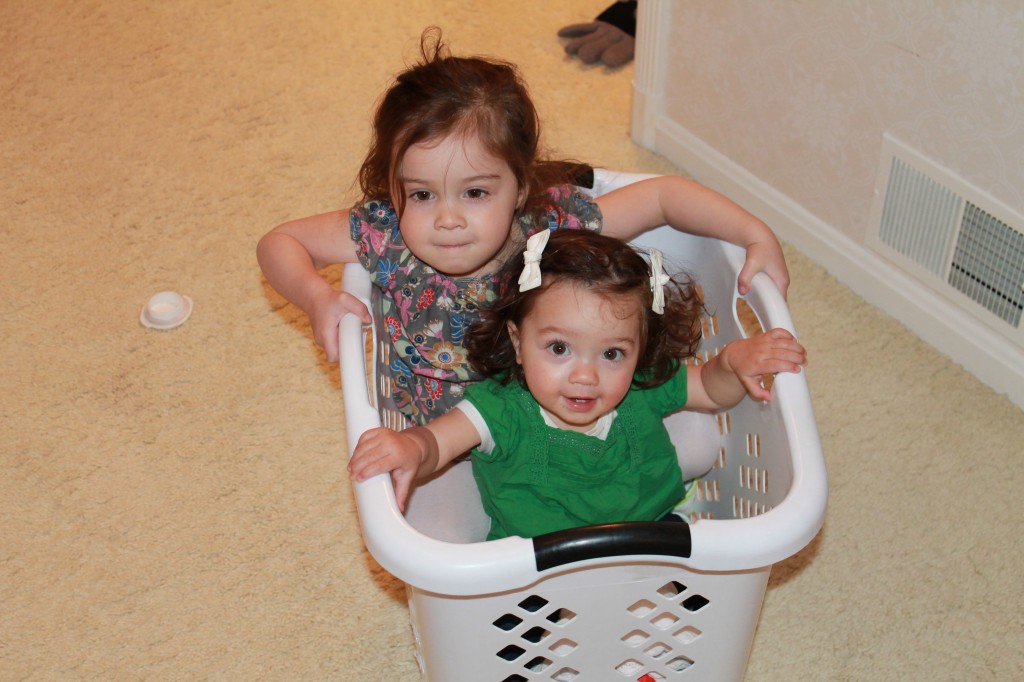 While I practiced, Abe took the girls on a ride in the laundry basket.