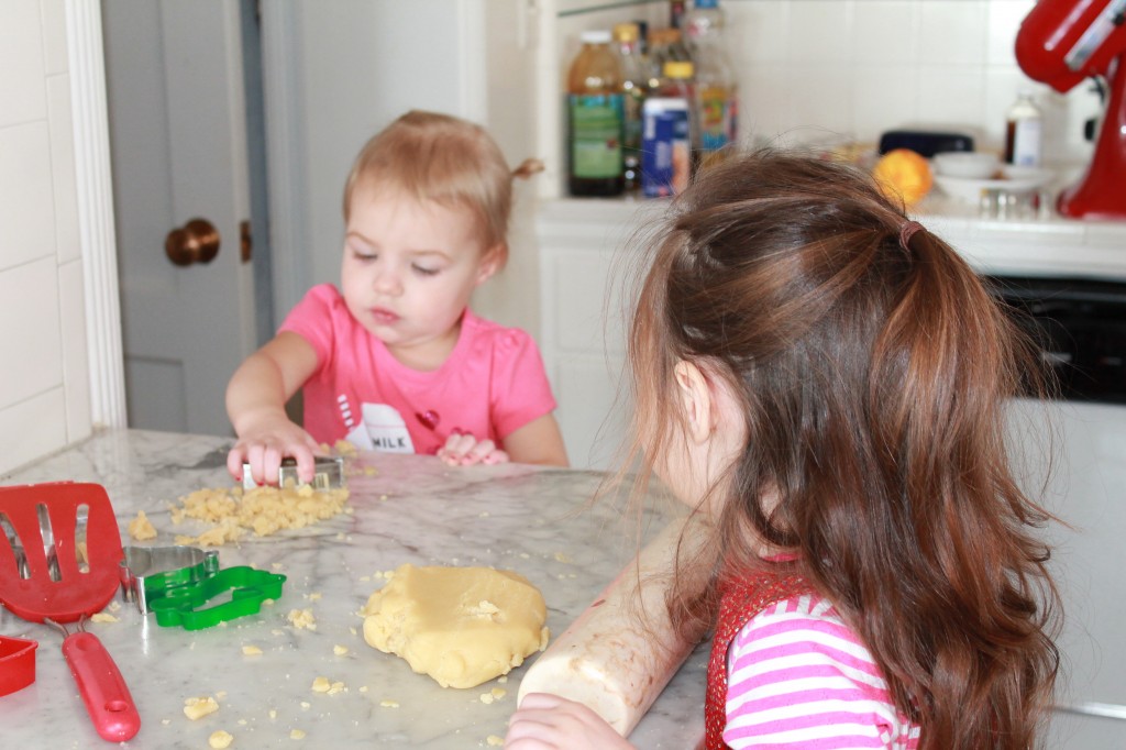 Lydia said, "Sophia, sweet-hawt, come here!" and then, when Sophia was rolling out the cookie dough: "Sophia, honey, there's dough sticking to the rowing pin. Wet me hewp you." (Lydia loves Sophia.)