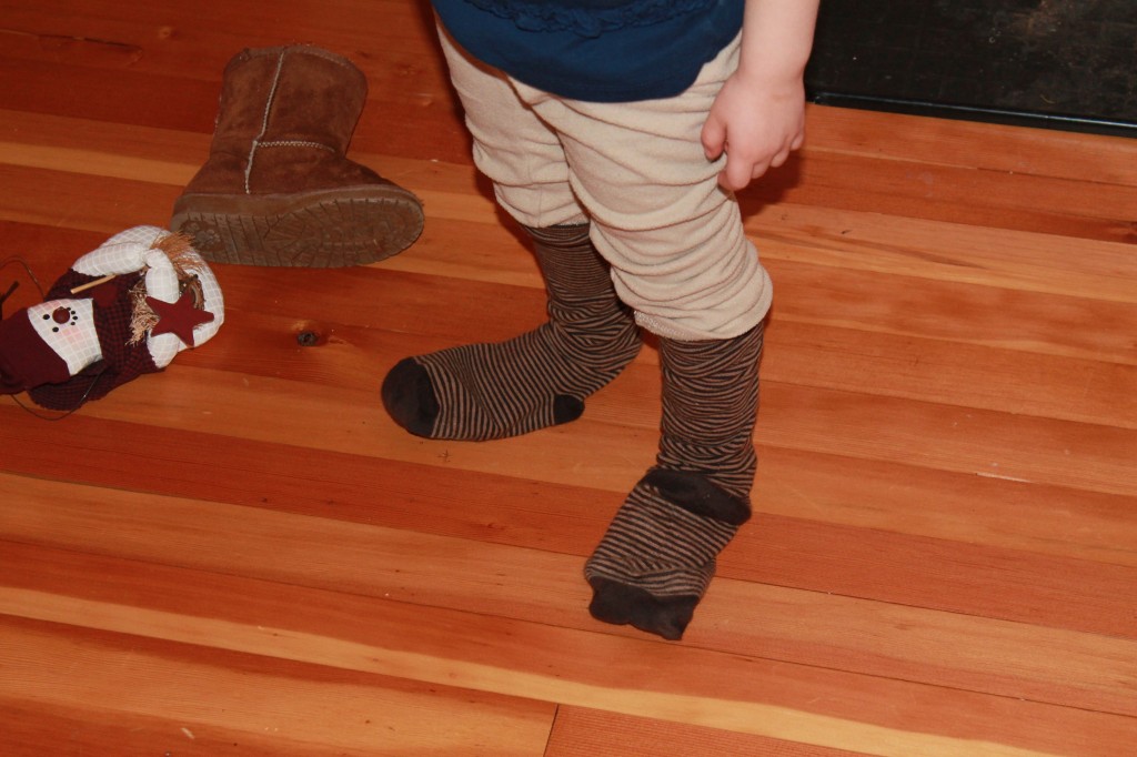 Before her nap, Lydia took a look at my feet and furrowed her brow. Then she said, "Actually, Mama, can I have one of your striped socks?" I acquiesced and handed over both for good measure. Minutes later she emerged from her bedroom with both of my socks on. In the video, you can see them dragging.