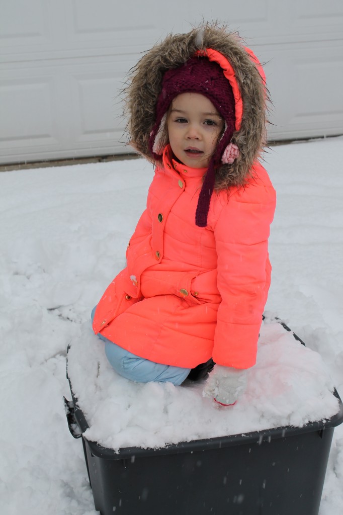 Lydia packed the snow by kneeling on it.