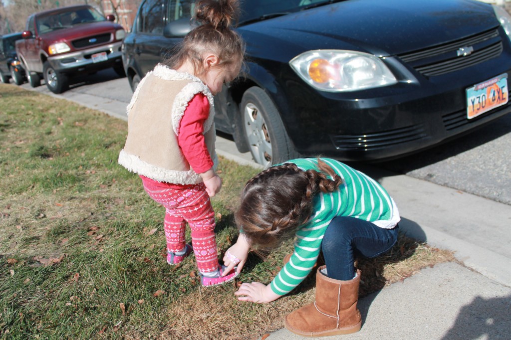 Lydia helped fix Mary's shoe strap while Mary's negligent mother looked on and took a picture.