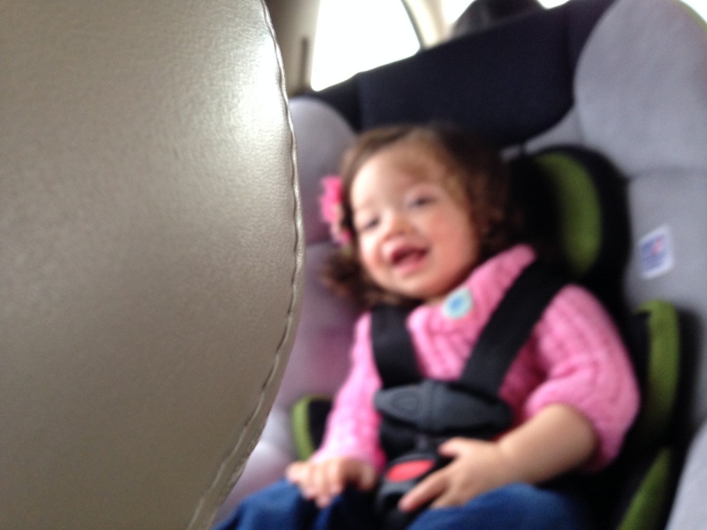 Mary laughing in the car as she played peek-a-boo with Georgia