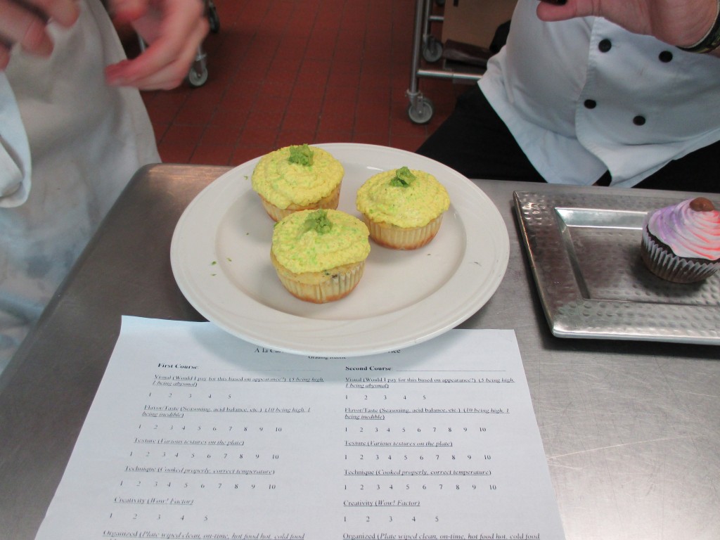 cornmeal cupcakes with saffron icing and avocado garnish.