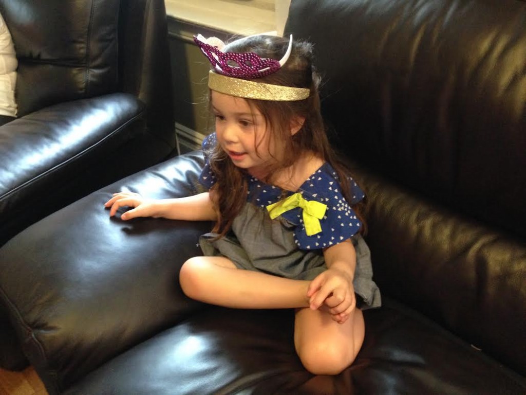 Movie marathon. Lydia needs to wear her glittery headband AND tiara to watch Frozen.