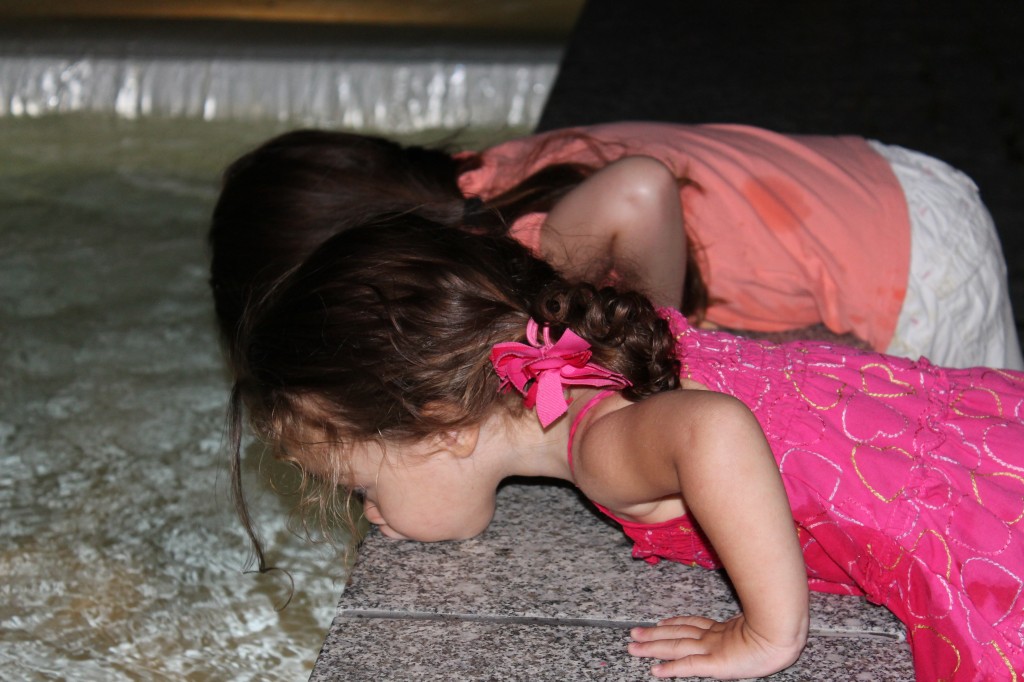 Watching their pennies sink to the bottom of the fountain.