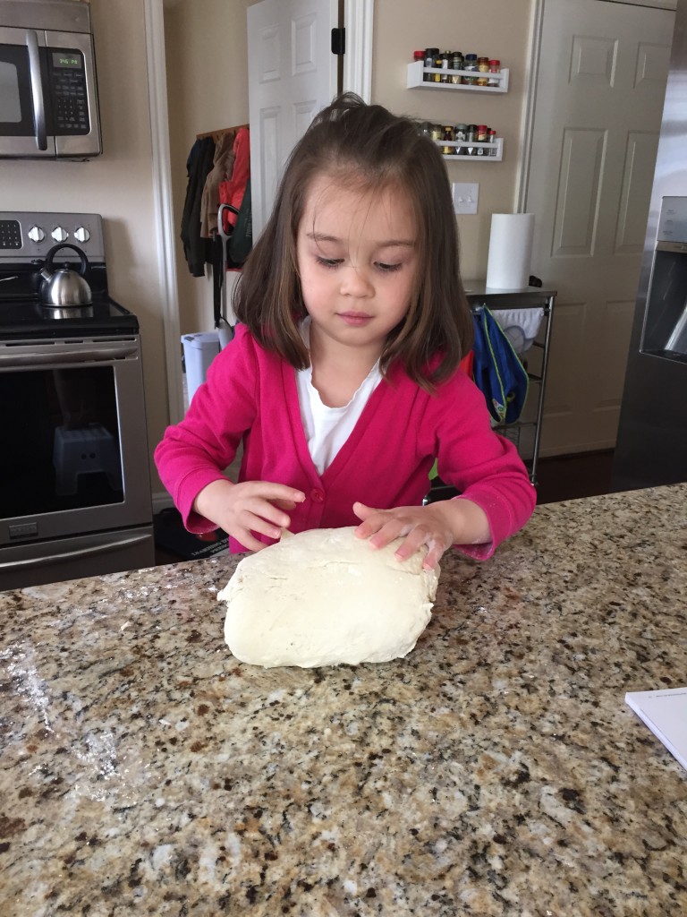 Lydia helping me make bread.