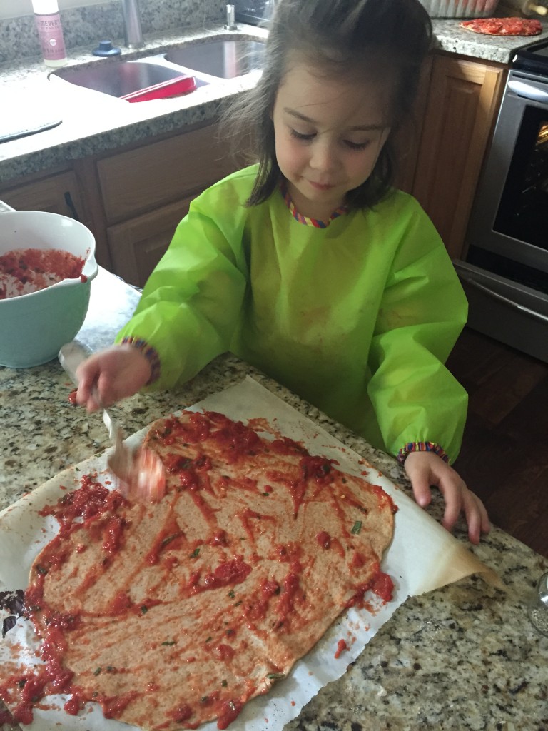 Making messy pizza.