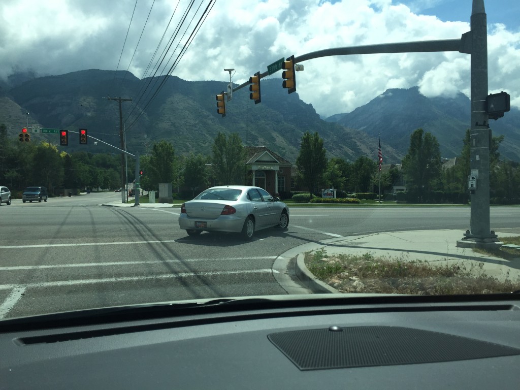 En route to the library at a stoplight. I just had to take a picture because those mountains take my breath away.