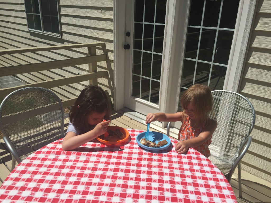 Lydia and Cadence eating cake. 
