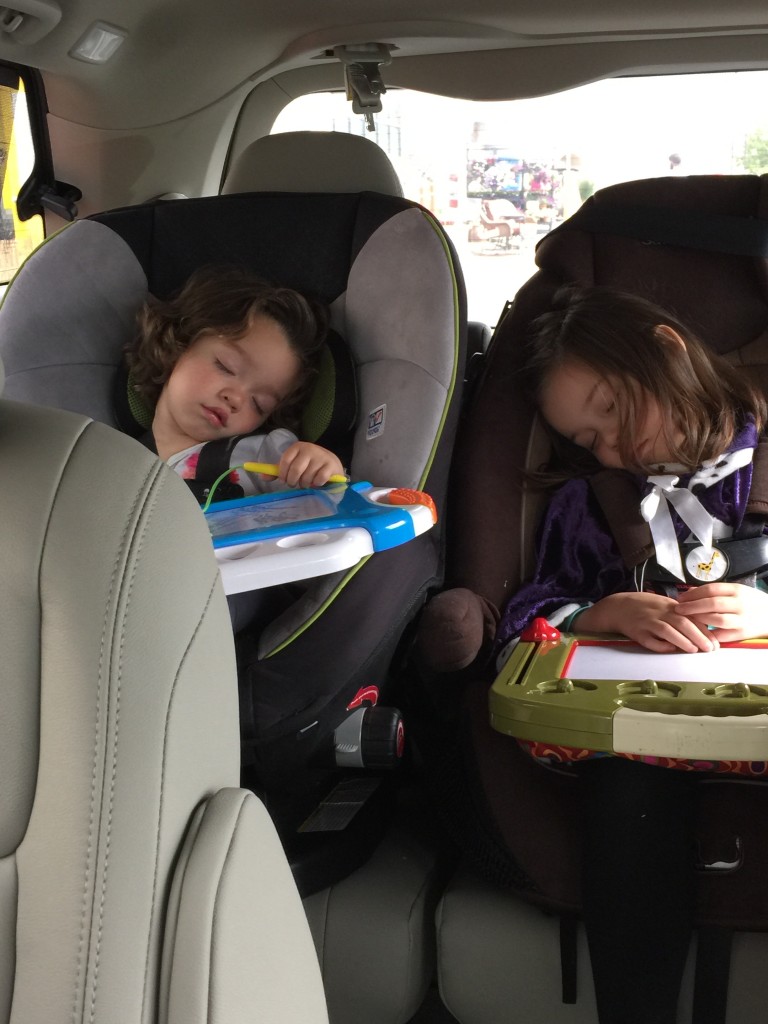 We have streamlined the toys that the kids get in the car. They get: magnetic sketch pads. And the occasional iPhone. It's so boring that they're sleeping in this pic.