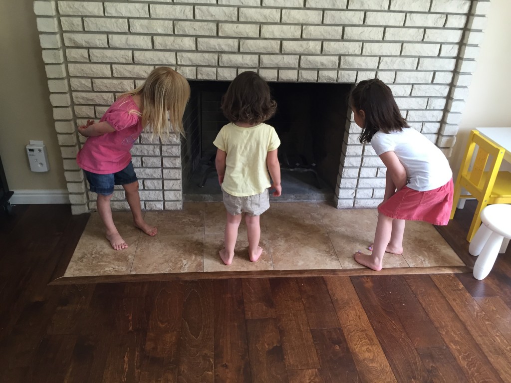 Lexi, the girls' darling babysitter, brought her little sister over while she babysat. Her sister, Elly, is Lydia's age. Lexi pretended there was a fairy in the house, and the girls went wild with delight trying to find the fairy. Here they are trying to figure out if the fairy is hiding in the fireplace.