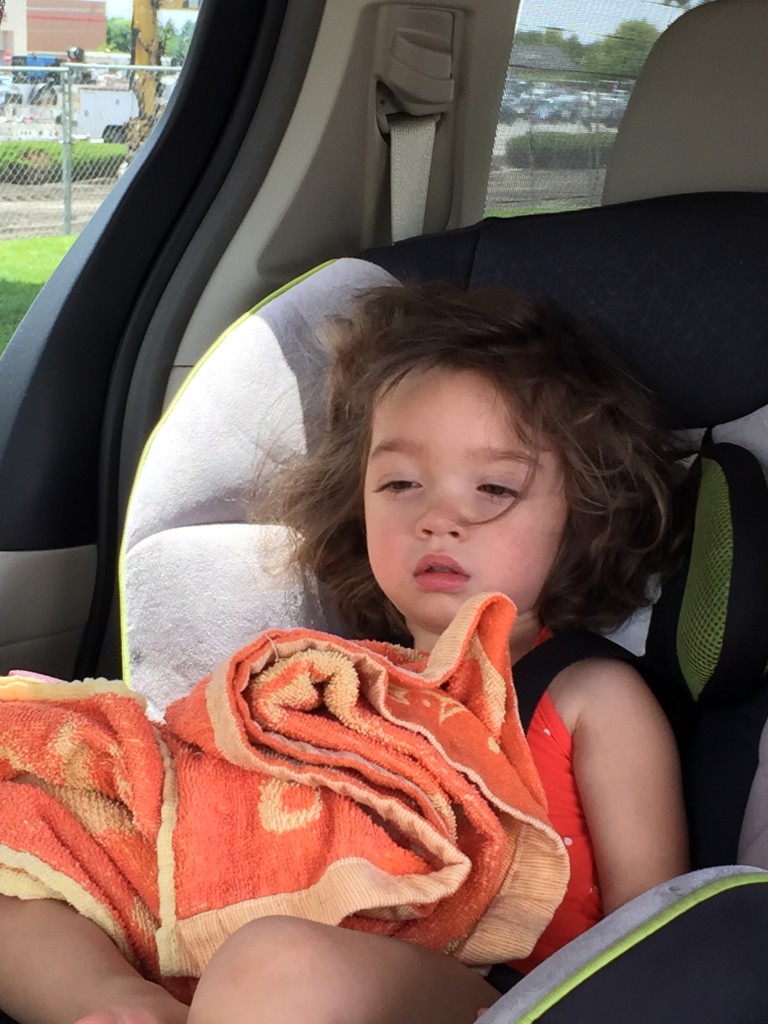 On the way to the splash pad, sleep-deprived Mary started to drift off. Her sleepy expression tickled Abe's funny bone and he took a picture.