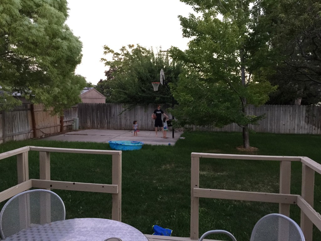 Abe and the girls played Horse after dinner. He tied a bucket to the basketball hoop pole so the girls could have a basket at their level. Here are two videos of the girls using his makeshift hoop. (When I took this picture, Abe was losing to the girls.)
