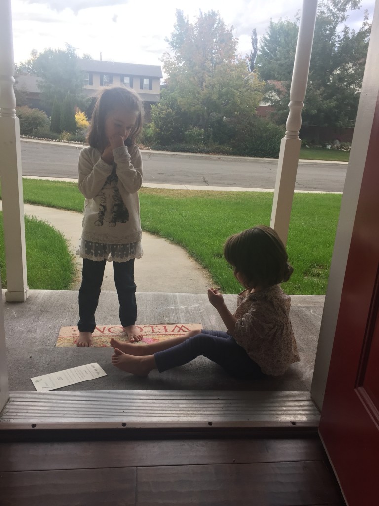 I took a ten minute break from cleaning to administer snacks to the girls. They had to eat outside since I'd already mopped the floors and scrubbed down the table. 