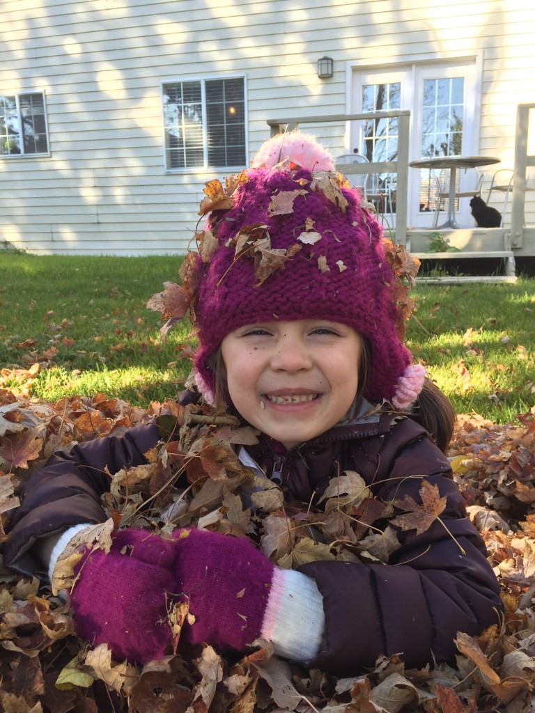 My heart stopped when I saw this picture. I have never seen Lydia smile like that. I must be doing something wrong if nothing I have done to date produced this look. This smile was the result of Abe's efforts to play with the girls in the leaf pile.