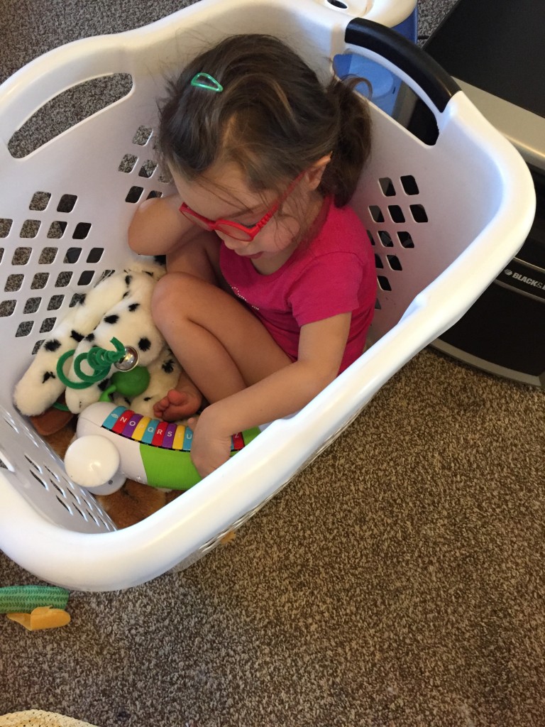 Instead of napping, Mary climbed in the laundry basket and played with her toys for an hour. 