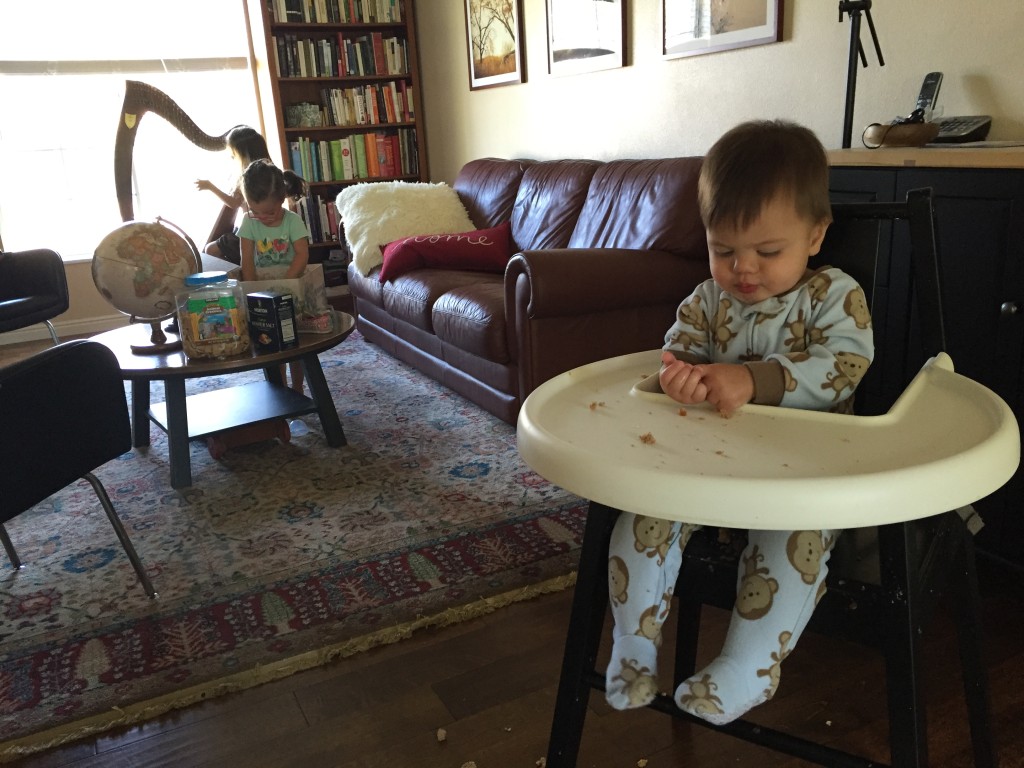 This is what our morning looks like every day. Lydia practices harp (and now piano too) before breakfast. I keep Ammon occupied (sort of) by feeding him breakfast. By the end of practice, he is a mess, but I took this before he reached that point. You can also spy Mary in the background filling a box with all sorts of oddities. She loves to fill containers with random things. Last week she hid Lydia's music book in a box in the closet and I berated myself for losing it. I felt better after discovering it last night. Today she put an open salt container in the pictured box. It spilled open. You can only imagine the mess.