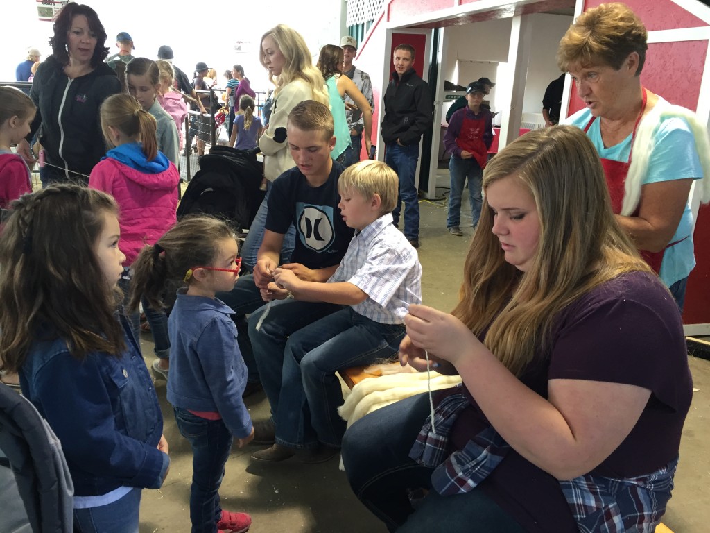 The girls got to help spin woolen bracelets.