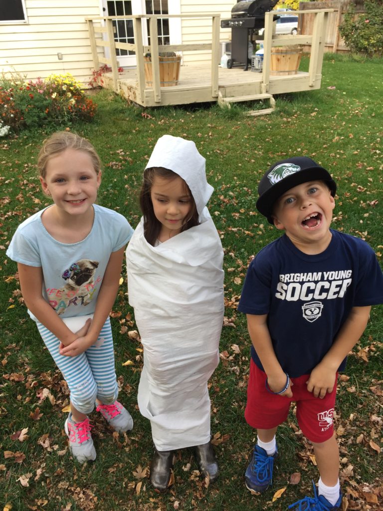 On Friday I was in charge of the mummy wrapping activity for Lydia's school's Halloween party. She was the only kid who wanted to be wrapped that didn't have a chance to get wrapped. I promised her that when we got home I would let her play with the neighbors and get wrapped by them. 