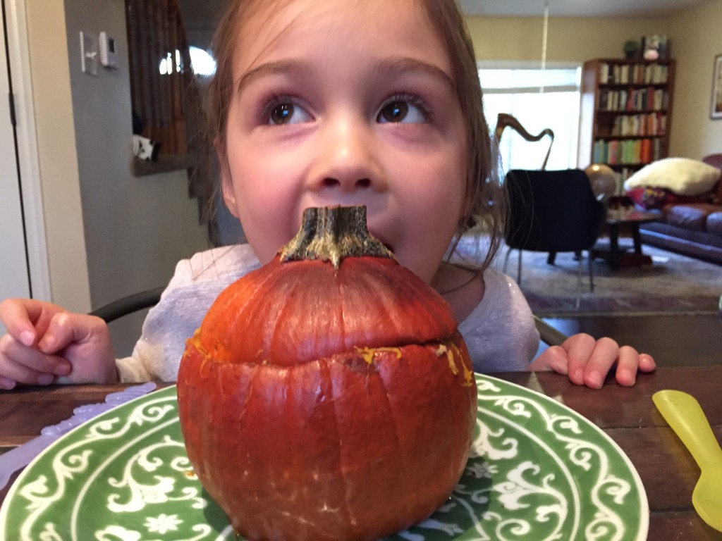 Lydia, as always, is our terrific eater. She ate all of the flesh of that pumpkin lid and kept exclaiming with delight.