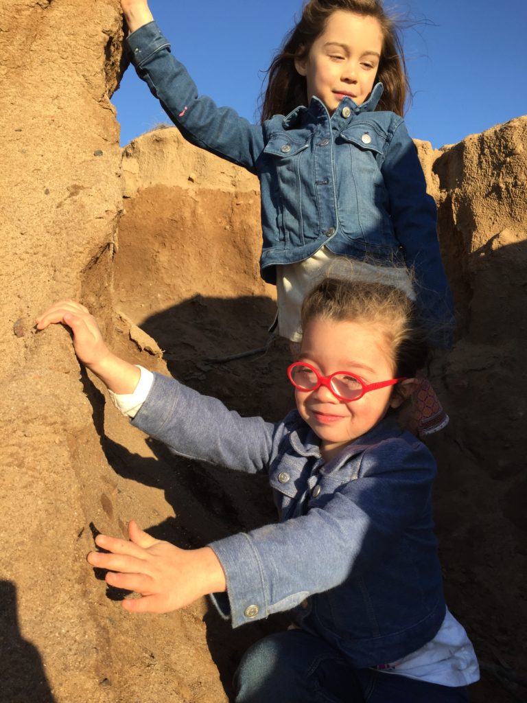 The girls climbed the sides of some of the sand cliffs and found a perfect spot to play house in.