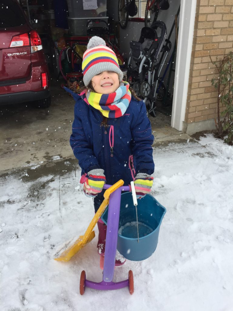 Lydia made "pies" out of snow and distributed them via this bucket.