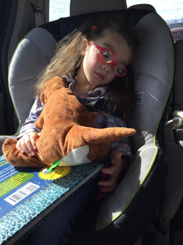 The girls hugged their stuffed dinos and read dino books on the way there.